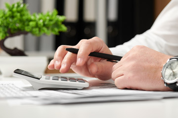 Fototapeta premium Businessman working in office and calculating finance. Business financial accounting concept.