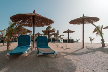 beach seats and umbrellas 