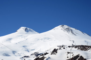 Fototapeta na wymiar Mountains with peaks covered with snow, Elbrus and the Caucasus