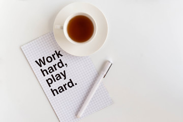A cup of coffee on the white desk. Work