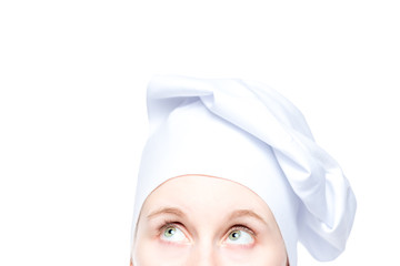 eyes of cook in hat close up on white background