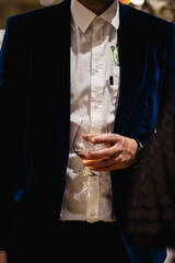 Obraz premium People standing chatting at a bussiness dinner holding whisky and wine glass tasting and degustating food chef's food