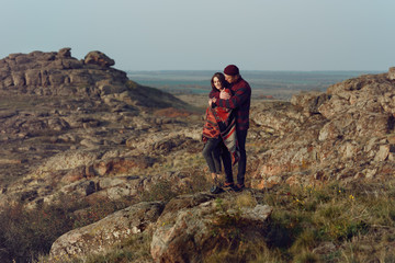 Obraz premium young couple in love walking in the wild wearing city clothes