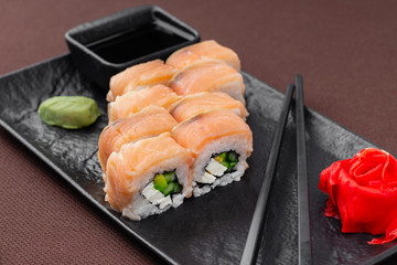 sushi on a black plate