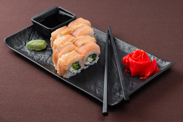 sushi on a black plate