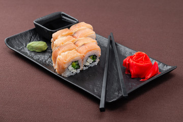 sushi on a black plate