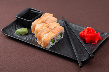 sushi on a black plate