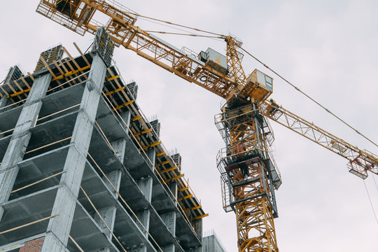 Construction of modern high-rise buildings. Phased construction of structures in winter.