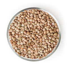 Green lentils in glass bowl isolated on white background with clipping path