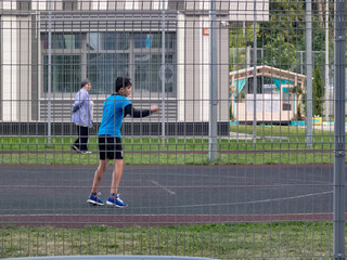 A boy trains in the yard