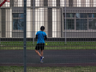 A boy trains in the yard