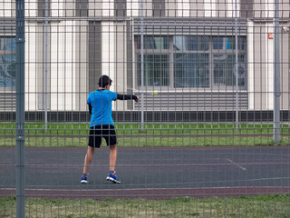 A boy trains in the yard