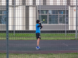 A boy trains in the yard