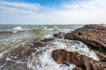 Splash of waves on a rocky seashore