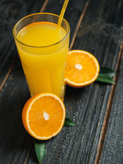 Fresh Orange juice on wooden background