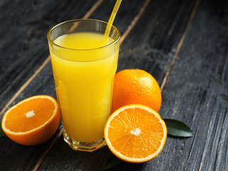 Fresh Orange juice on wooden background