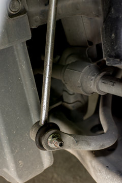Close up of new stabilizer link on old car