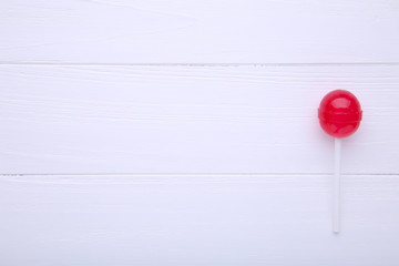 Sweet red lollipop on white background. sweet candy concept