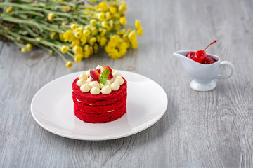 Thai red cake. Velvet red cake. Cookies decorated with red cake on wooden table and flower. strawberries morning. Cherry in the cup. Sweet and Cherry.