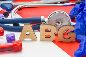 ABG medical abbreviation meaning arterial blood gas in blood in laboratory diagnostics on red...