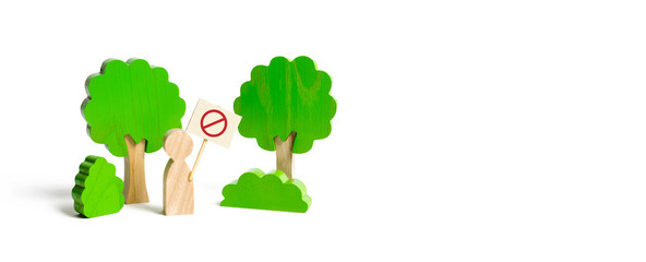 The figure of a man with a poster shows a protest in the forest. Nature reserves, guardian of the...