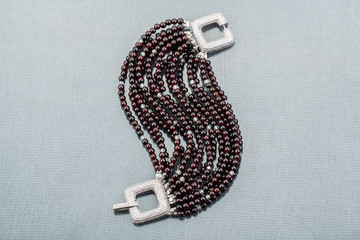 A multirow bracelet from garnet and topazes