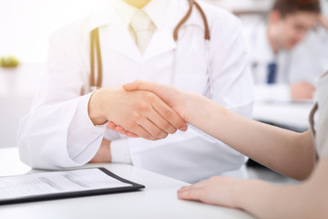 Partnership, trust og doctor and patient, medical ethics concept. Handshake in medicine