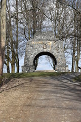 Fototapeta na wymiar Landscape in Zeulenroda in Thüringen with many trees and a stone gate in Germany