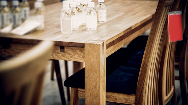 Varnish For Processing Furniture Made Of Wood. Table And Chairs From Solid Oak.