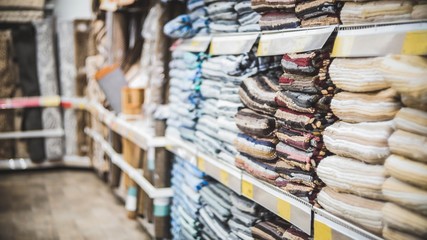 multicolored, variegated fabrics in the textile store. Linen things.