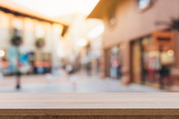 Empty wood table and Vintage tone blurred defocused of crowd people in walking street festival and shopping mall.