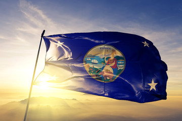 Governor of California flag waving on the top sunrise mist fog