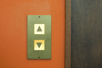 A lit elevator button