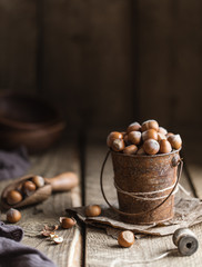 Hazelnuts on rustic wooden background. Food background 