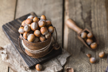 Hazelnuts on rustic wooden background. Food background 