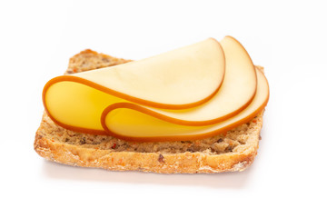 Sandwich with lettuce, cheese on white background.