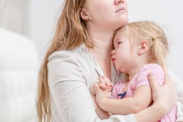 Fototapeta na wymiar Mother calming her crying baby girl
