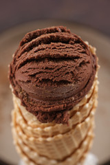 Chocolate ice cream in a waffle cone. Macro shooting