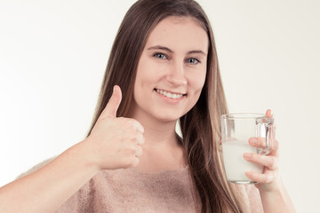 girl drinks milk and is happy