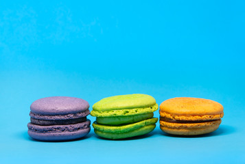 Colourful macaroons on a blue background