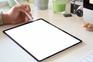 Man sitting and woking with tablet in office workplace