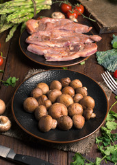 roasted turkey fillets mushrooms and other vegetables, on classic wooden board