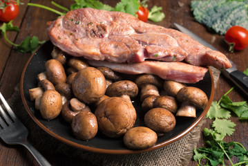 roasted turkey fillets mushrooms and other vegetables, on classic wooden board