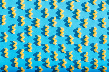Pasta closeup on a blue background. View from above.