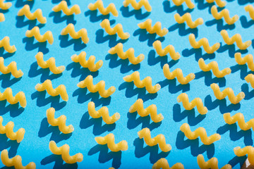 Pasta closeup on a blue background. View from above.