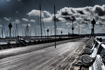 Friends chatting on old promenade © brightimage