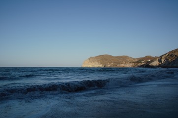 Far landscape view of the black beach Santorini 
