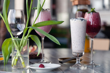 Food shooting. Berry cocktail in crystal glass decorated mint, berries, pomegranate, orange, pineapple. Concept summer drinks, fresh, milkshake, smoothies, lemonade, soft drinks, alcoholic cocktails