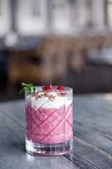 Food shooting. Berry cocktail in crystal glass decorated mint, berries, pomegranate, orange, pineapple. Concept summer drinks, fresh, milkshake, smoothies, lemonade, soft drinks, alcoholic cocktails