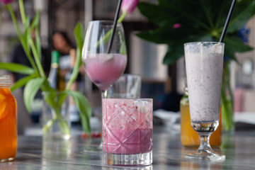 Food shooting. Berry cocktail in crystal glass decorated mint, berries, pomegranate, orange, pineapple. Concept summer drinks, fresh, milkshake, smoothies, lemonade, soft drinks, alcoholic cocktails